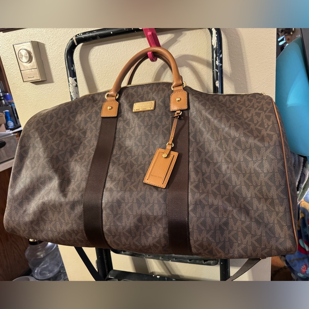 NWT Michael Kors Duffle Bag with classic pattern, handle strap and long strap